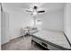 Spacious bedroom with a crib, high chair, and ceiling fan at 1856 Red Loop, Lakeland, FL 33801