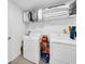 Laundry room with washer, dryer, and shelving at 1856 Red Loop, Lakeland, FL 33801