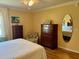 Bright bedroom with hardwood flooring and a full-size bed at 457 Enright Pl, The Villages, FL 32162