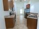 Modern kitchen with wood cabinets and tile flooring at 4852 Magnolia Preserve Dr, Winter Haven, FL 33880