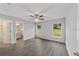 Bedroom with wood-look floors, ceiling fan, and en-suite bathroom at 6459 Sw 204Th Ave, Dunnellon, FL 34431