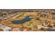 Aerial view of community golf course with homes and a pond at 11276 Se 170Th Pl, Summerfield, FL 34491