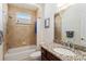 Bathroom with shower, granite vanity, and large mirror at 11276 Se 170Th Pl, Summerfield, FL 34491