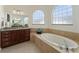 Spa-like bathroom with soaking tub and walk-in shower at 11276 Se 170Th Pl, Summerfield, FL 34491