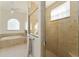 Bathroom with a large walk-in shower and a window at 11276 Se 170Th Pl, Summerfield, FL 34491
