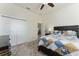 Bedroom with a dresser, ceiling fan, and view of dining area at 11276 Se 170Th Pl, Summerfield, FL 34491