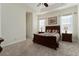 Bright bedroom with carpeted floor, ceiling fan, and ample closet space at 11276 Se 170Th Pl, Summerfield, FL 34491