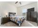 Bedroom with dresser, TV, and ceiling fan at 11276 Se 170Th Pl, Summerfield, FL 34491