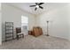 Empty bedroom with chair, shelves and boxes at 11276 Se 170Th Pl, Summerfield, FL 34491
