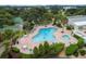Resort-style community pool with plenty of lounge chairs at 11276 Se 170Th Pl, Summerfield, FL 34491