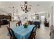 Dining area with a chandelier and view into the Gathering room at 11276 Se 170Th Pl, Summerfield, FL 34491