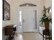 Bright and spacious foyer with tiled floors and decorative accents at 11276 Se 170Th Pl, Summerfield, FL 34491