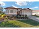 Beautiful one-story home with a two-car garage and manicured lawn at 11276 Se 170Th Pl, Summerfield, FL 34491