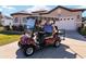 Happy homeowner showing off their new house and golf cart! at 11276 Se 170Th Pl, Summerfield, FL 34491