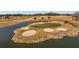 Island green golf course hole surrounded by water at 11276 Se 170Th Pl, Summerfield, FL 34491
