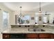 Kitchen features a double sink, granite counters, and dishwasher at 11276 Se 170Th Pl, Summerfield, FL 34491