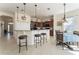 Kitchen boasts granite counters, dark wood cabinets, and island at 11276 Se 170Th Pl, Summerfield, FL 34491