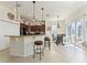 Kitchen with granite island, breakfast nook, and sliding doors at 11276 Se 170Th Pl, Summerfield, FL 34491