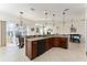 Kitchen with large island, granite counters, and breakfast bar at 11276 Se 170Th Pl, Summerfield, FL 34491