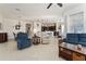 Spacious living room with seating area and large windows at 11276 Se 170Th Pl, Summerfield, FL 34491
