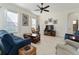 Living room with comfortable seating and a large-screen TV at 11276 Se 170Th Pl, Summerfield, FL 34491