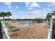 Community pool with lounge chairs and a shaded area at 11276 Se 170Th Pl, Summerfield, FL 34491