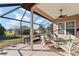 Enjoy this spacious screened patio, perfect for outdoor dining and relaxation at 11276 Se 170Th Pl, Summerfield, FL 34491