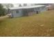 Side view of the house and yard at 1236 Ne 22Nd St, Ocala, FL 34470