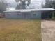 Gray house with carport and yard at 1236 Ne 22Nd St, Ocala, FL 34470