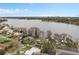 Expansive aerial view of a lakeside community with beautiful homes and lush trees at 301 Rippling Ln, Winter Park, FL 32789