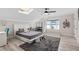 Comfortable bedroom featuring a skylight, modern furniture, and bright bay window at 301 Rippling Ln, Winter Park, FL 32789