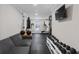 Home gym features rubber flooring, exercise equipment, and a walkout to the exterior at 301 Rippling Ln, Winter Park, FL 32789