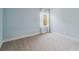 Spacious bedroom with light blue walls and carpeted floor at 2016 Sanderlin Point Loop, Apopka, FL 32703