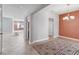 Dining room with tile floor, coral curtains, and chandelier at 2016 Sanderlin Point Loop, Apopka, FL 32703