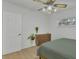 Bedroom with light wood floors, a dresser, and a green duvet at 270 N 1St St, Lake Mary, FL 32746