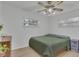 Bedroom with light wood floors, a dresser, and a green duvet at 270 N 1St St, Lake Mary, FL 32746