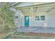 Charming front porch with teal door and decorative metal railings at 270 N 1St St, Lake Mary, FL 32746