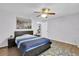 Bedroom with a double bed, nightstands, and ceiling fan at 11924 Pethrick Dr, Orlando, FL 32824