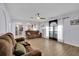 Living room with two brown sofas and large windows at 11924 Pethrick Dr, Orlando, FL 32824