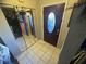 Front entry with a dark-stained door and mirrored closets at 1880 N Crystal Lake Dr # 57, Lakeland, FL 33801