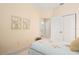 Light and airy bedroom with a double bed and access to a bathroom at 461 Troy Loop, The Villages, FL 32162