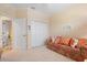 Cozy guest bedroom with a sofa bed, closet, and window at 461 Troy Loop, The Villages, FL 32162