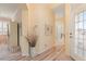 Bright hallway with light flooring and decorative accents at 461 Troy Loop, The Villages, FL 32162