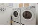 Convenient laundry room with washer and dryer at 461 Troy Loop, The Villages, FL 32162