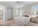 Spacious main bedroom with a king-size bed and en-suite bathroom at 461 Troy Loop, The Villages, FL 32162