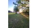 Private backyard with shed and open grassy space at 4635 Deer Run Rd, St Cloud, FL 34772