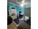 Bright bedroom featuring a workspace and twin-size beds at 4635 Deer Run Rd, St Cloud, FL 34772