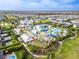 Aerial view of a community with a waterpark, resort-style amenities, and multiple pools at 220 Clawson Way, Kissimmee, FL 34747