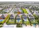 Aerial view of the neighborhood showing the home, pools, landscaping, and street layout at 220 Clawson Way, Kissimmee, FL 34747