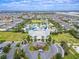 Aerial view of the community clubhouse, waterpark, resort-style amenities and landscaped common areas at 220 Clawson Way, Kissimmee, FL 34747
